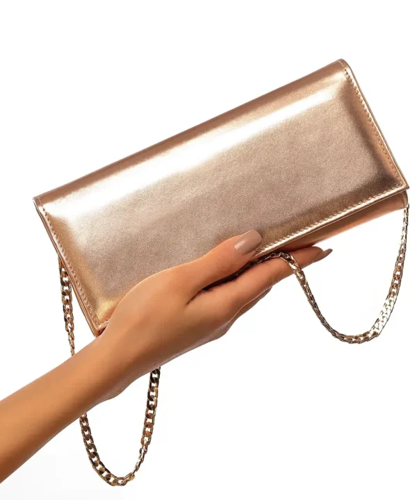 Sac à main rose gold en cuir Mautassin, accessoire glamour et fonctionnel.